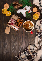 Hand crafted gift with natural Christmas decorations without plastic, cup of coffee and cookies