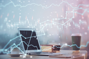 Forex Chart hologram on table with computer background. Multi exposure. Concept of financial markets.