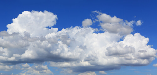 blue sky with white fluffy cloud background