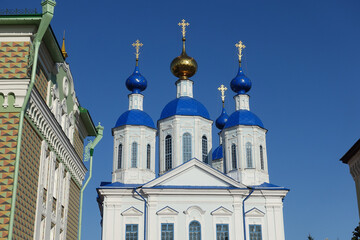 Fototapeta na wymiar Domes of Kazan Cathedral against the sky in Tambov, Russia