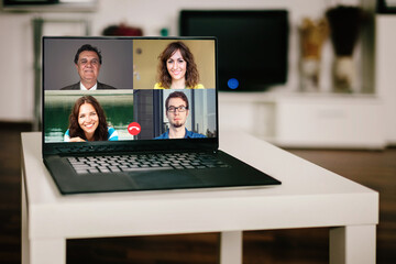 Laptop screen, person talking to their colleagues about plan in video conference. Business team using laptop for a online meeting in video call. Group of people smart working from home