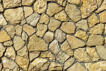 Old stone wall background texture close up. Stone background. 