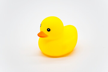 Yellow little duck doll, yellow rubber duck doll, duck bath toy for children, baby toy on white background.