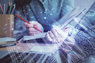 IOT drawing over writing hands in notepad background. Concept of smart home. Multi exposure