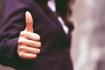 business person giving thumbs up