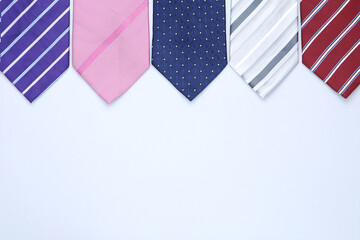 Colorful neckties on grey background