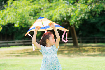 Girl playing with a kite
