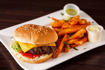Cheeseburger with spicy fries