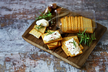 Garlic crackers with cream cheese. Appetizing snack. Keto snack. Selective focus. Macro.