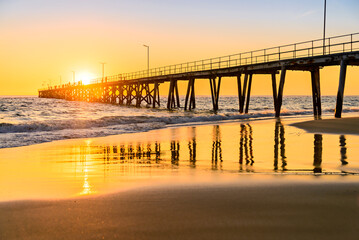 Fototapeta premium People walking on Port Noarlunga jetty at sunset, South Australia