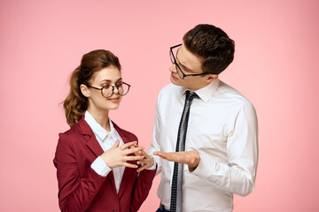 business man and woman office work colleagues team office management studio pink background
