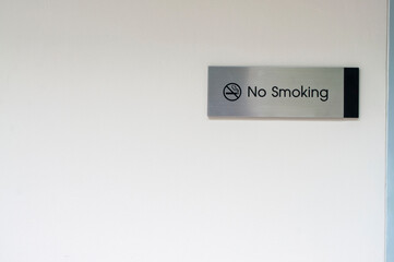 A no smoking sign on a white background
