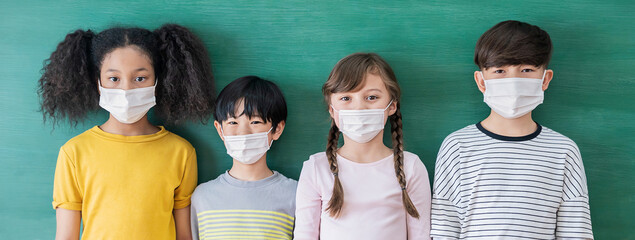 Portrait of group of international students wearing face mask, self-protection from corona virus pandemic. New normal children lifestyle, back to school banner