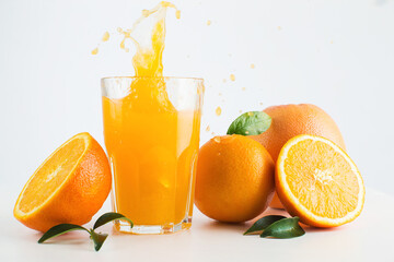 Citrus fruits and glass of orange juice