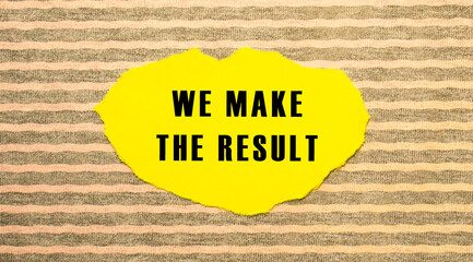 Yellow torn paper with the text WE MAKE THE RESULT on a gray-pink background.