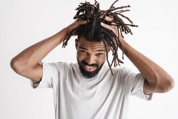 Photo of displeased african american guy grabbing her head
