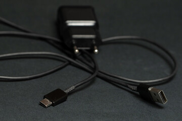 mobile phone charger cable, isolated on black background