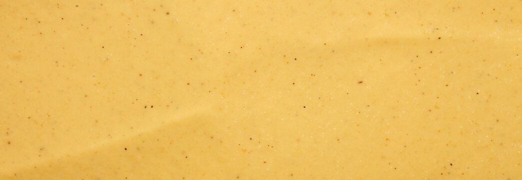 Russian mustard.The texture of the mustard.Yellow mustard background top view.
