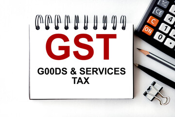 gst. text on white paper on light background