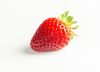 A close-up picture of a bright one red strawberry or berry as a fruit or food. An isolated white background is a naturally fresh fruit.