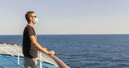 Portrait of man Traveling by Ferry Boat During Covid 19, Wearing Mask and Enjoying the Beautiful View.