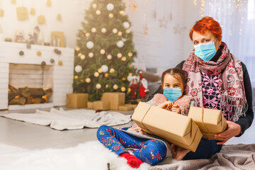 family in protective masks quarantined. Normal life with coronavirus. Lifestyle COVID-19. Quarantine virus protection. christmas