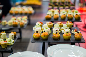 mix canapes on a tray during a coffee break