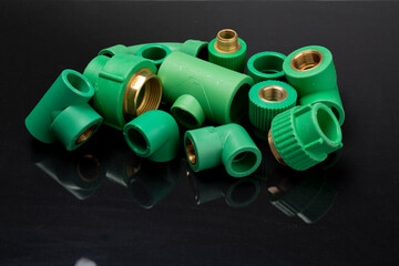  Plastic T-tube fittings on Black background, PVC Pipe connections, PVC Pipe fitting, PVC Coupling
