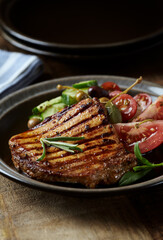 Grilled Turkey Breast with fresh salad. Close up.	