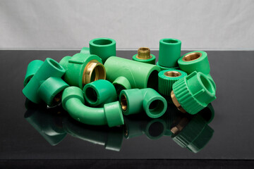  Plastic T-tube fittings on Black background, PVC Pipe connections, PVC Pipe fitting, PVC Coupling
