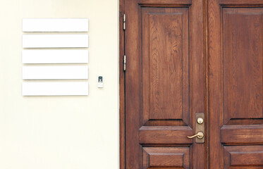 Classic wooden office doors with blank signboards on the wall to place company names and logos, business mockup