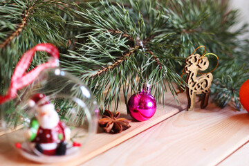 Pine branch, chocolate, orange and beautiful Christmas decorations