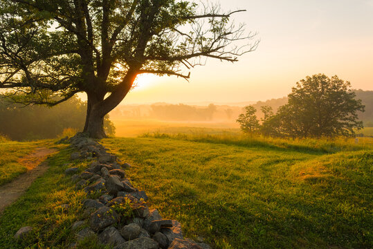 Foggy sunrise on East Cemetery Hill at Gettysburg Nation Military Park in Gettysburg, PA, USA.