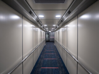Jetway, walking towards the plane on carpet, seeing the plane door. perspective aerobridge corridor to aircraft.