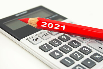 Calculator and red pen 2021