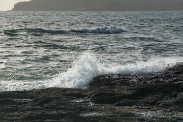 Panoramic view of sea waves crashing on rocks at Velneshwar beach in India