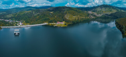 Fototapeta na wymiar Aerial drone panorama of water dam or Vodna Nadrz in Nova Bistryca, Slovakia. Big water dam and reservoir for the safety of the people and energy generation.