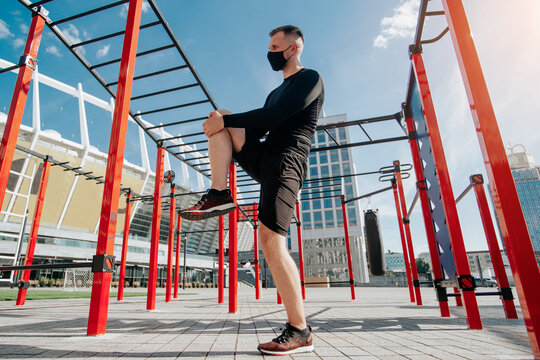 man doing leg stretching outdoors