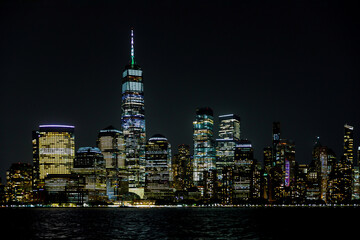 Fototapeta na wymiar Amazing panoramic view of New York city skyline and skyscraper at beautiful night view in midtown Manhattan.