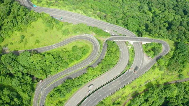 Busy Highway traffic motors on the Mumbai Pune Expressway during a busy morning through the western ghats