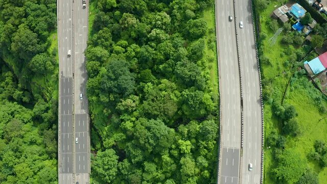 Flying shot over two parallel roads on the Pune Mumbai expressway around Khandala