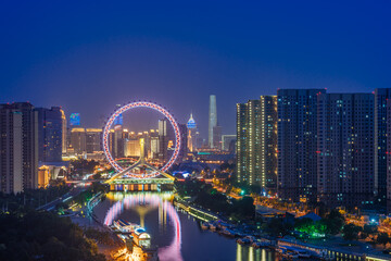 Fototapeta premium Close-up of night view of Ferris wheel in Tianjin Eye, Tianjin, China
