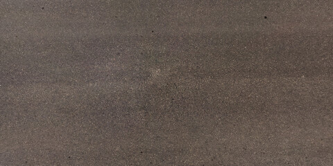 view from above on texture of old asphalt road with cracks