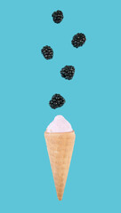 fresh ripe blackberries fall into a waffle cone. concept of ice cream with blackberry flavor in a waffle cone. Isolate on a blue background