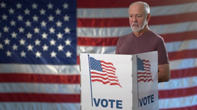 Conceptual portrait US flag background with happy smiling man giving thumbs up, in voting booth at ballot box, careful decision for president in US election.