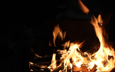 Fire isolated on a black background. Burning flame or fire burning at night. Artistically blurry, copy space. Soft focus