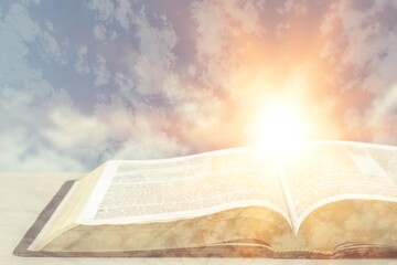 Holy Bible book on a wooden desk