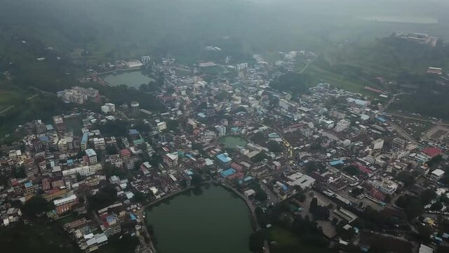 Flying Through Trimbakeshwar Town Nestled At The Lush Green Hilly Terrain In Western Ghats, Maharashtra, India - Aerial Shot (Drone)