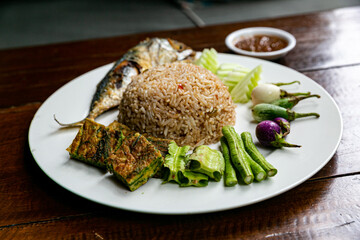 Thai food dish called Rice Mixed with Shrimp pasta  Served with mackerel and soup