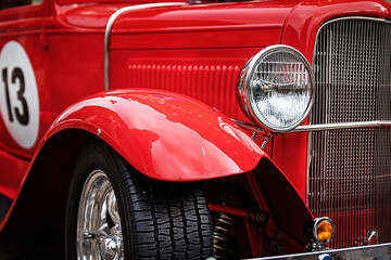 closeup of red restored retro sport car front